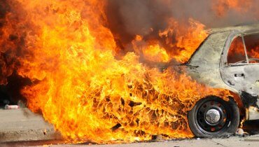 Image of Two Cars Burn in the Aftermath of Fatal Accident on 60 Freeway