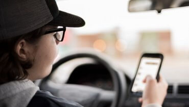 Image of New York Cops Looking at Device to Detect Texting Drivers