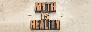 A banner that reads Myth vs Reality in a mix of high and lower case letters to Illustrate 7 Auto Insurance myths busted.