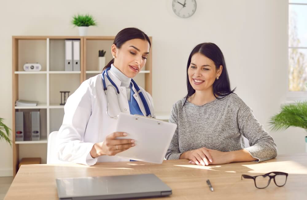 Woman reviewing the requirements to apply for Covered California