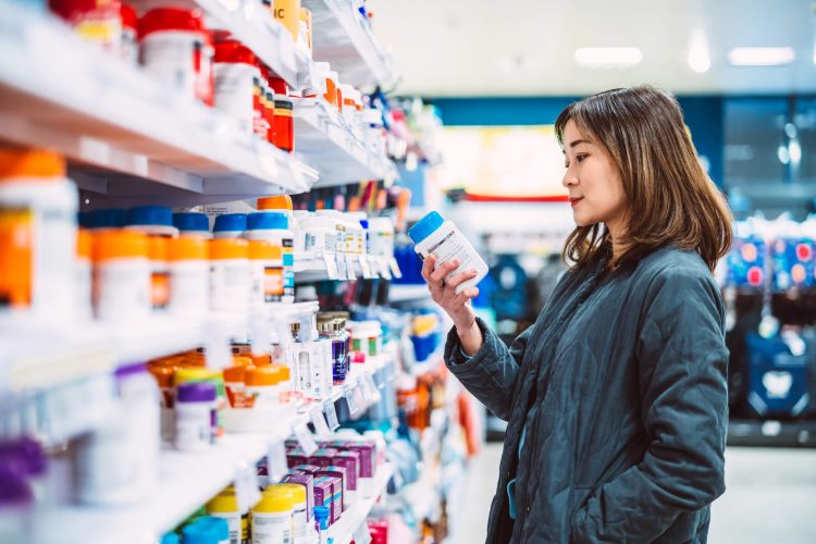 Young Asian woman shopping for prescription