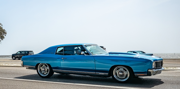 Wide angle side view of a 1971 Chevrolet Monte Carlo 2 Door Hardtop at a local car show in Gulfport, MS – cheap car insurance.